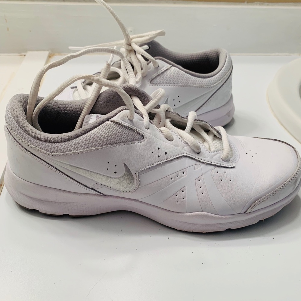 White Nike athletic shoes